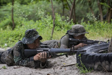 U.S. Marine Lance Cpl. Christopher Gonzalez, a scout swimmer assigned to Fox Company, Battalion Landing Team 2nd Battalion, 4th Marine Regiment, 31st Marine Expeditionary Unit, provides security for Philippine Marines while conducting an amphibious raid as part of the Philippine Amphibious Landing Exercise 33 (PHIBLEX), at Marine Barracks Gregorio Lim, Ternate, Philippines, Oct. 6, 2016.PHIBLEX 33 is an annual bilateral exercise conducted with the Armed Forces of the Philippines that combines amphibious capabilities and live-fire training with humanitarian civic assistance efforts to strengthen interoperability and working relationships through commitment, capability and cooperation. Gonzalez is a native of Chicago, Illinois. (U.S. Marine Corps photo by Cpl. Darien J. Bjorndal/ Released) 