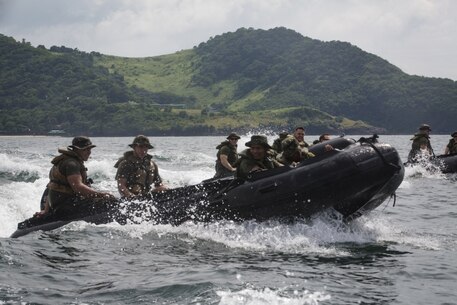 Philippine Marines join U.S. Marines with Fox Company, Battalion Landing Team, 2nd Battalion, 4th Marine Regiment, 31st Marine Expeditionary Unit, during combat rubber raiding craft training as part of Philippine Amphibious Landing Exercise 33 (PHIBLEX 33) off the coast of Marine Barracks Gregorio Lim, Ternate, Philippines, Oct. 5, 2016. PHIBLEX 33 is an annual bilateral exercise conducted with the Armed Forces of the Philippines that combines amphibious capabilities and live-fire training with humanitarian civic assistance efforts to strengthen interoperability and working relationships through commitment, capability and cooperation. (U.S. Marine Corps photo by Cpl. Darien J. Bjorndal, 31st Marine Expeditionary Unit/ Released)