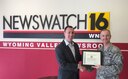 Master Sgt. Michael Halbrook, 314th Recruiting Squadron, B-Flight chief, presents a certificate of appreciation to Matt Petrillo of WNEP News out of Scranton, Penn., for his efforts to hilight the recruiting needs and efforts in northeast Pennslyvania.