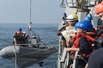 Sailors assigned to the guided-missile destroyer USS Nitze assist a distressed Iranian vessel. Nitze, deployed as part of the Eisenhower Carrier Strike Group, is supporting maritime security operations and theater security cooperation efforts in the U.S. 5th Fleet area of operations. Navy photo by Petty Officer 3rd Class Casey J. Hopkins