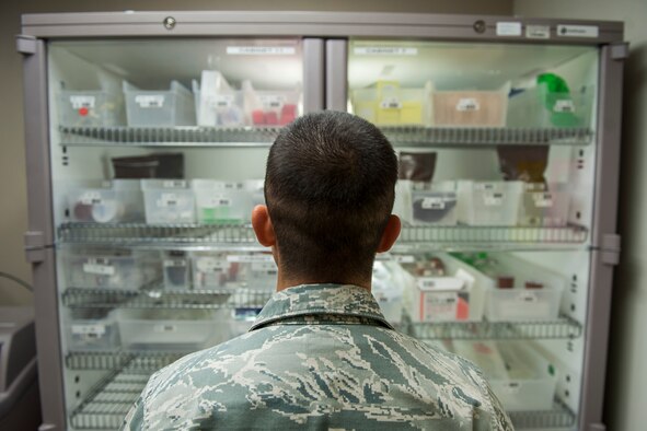 Staff Sgt. Victor Rodriguez, 99th Medical Support Squadron pharmacy technician, refills the Pyxis machine in the intensive care unit of the Mike O’Callaghan Federal Medical Center on Nellis Air Force Base, Nev., Nov. 22, 2016. With the Pyxis machine being utilized, the pharmacy has seen its inaccuracy rates fall. (U.S. Air Force photo by Airman 1st Class Kevin Tanenbaum/Released)