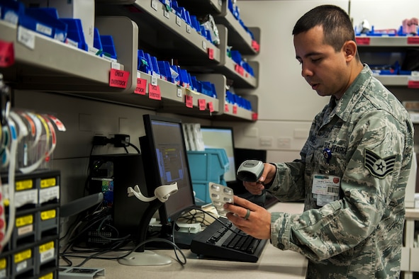 Staff Sgt. Victor Rodriguez, 99th Medical Support Squadron pharmacy technician, scans a medication into the Pyxis database at the Mike O’Callaghan Federal Medical Center on Nellis Air Force Base, Nev., Nov. 22, 2016. 18 new Pyxis machines were implemented throughout the wards of the MOFMC in March, and with these new machine the pharmacy changed the way that each medication was utilized in the system. (U.S. Air Force photo by Airman 1st Class Kevin Tanenbaum/Released) 
