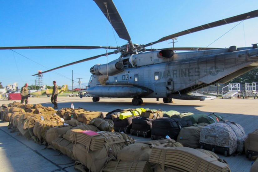 Marines deployed to Honduras prepare a CH-53E Super Stallion helicopter to deploy to Grand Cayman Island, Oct. 4, 2016. U.S. Southern Command directed a team of about 100 military personnel and nine helicopters to Grand Cayman Island where they will be staged and ready to support U.S. disaster relief operations in the Caribbean if requested by U.S. Agency for International Development. Marine Corps photo