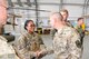 Lt. Gen. Jeffrey Harrigian, U.S. Air Forces Central Command commander and Air Component commander for CENTCOM, talks with Master Sgt. Deborah Enoch, 438th Air Expeditionary Wing command chief executive assistant, during his visit to Kabul Air Wing, Afghanistan, Oct. 5, 2016