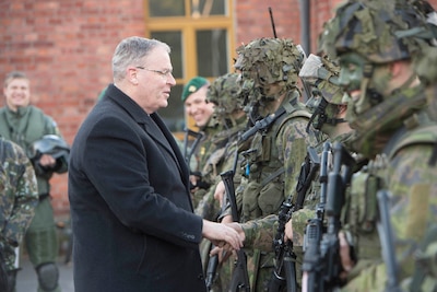 Deputy Defense Secretary Bob Work greets Finnish defense forces in Helsinki, Oct. 6, 2016. En route to Finland, Work commented on what he called a “humanitarian catastrophe” in Aleppo, Syria. DoD photo by Navy Petty Officer 1st Class Tim D. Godbee