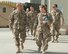 Lt. Gen. Jeffrey Harrigian, U.S. Air Forces Central Command commander, walks with Lt. Col. Joy Boston, 455th Expeditionary Operations Support Squadron commander, Bagram Airfield, Afghanistan, Oct. 5, 2016. Boston explained some of the unique issues that Airmen face when conducting airfield operations at Bagram. (U.S. Air Force photo by Capt. Korey Fratini)