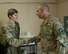 Lt. Gen. Jeffrey Harrigian, U.S. Air Forces Central Command commander, presents a coin to Capt. Anna Gault, 455th Air Expeditionary Wing Sexual Assault Response Coordinator, Bagram Airfield, Afghanistan, Oct. 5, 2016. Harrigian visited the 455th Air Expeditionary Wing to recognize Airmen and see the mission first hand. (U.S. Air Force photo by Capt. Korey Fratini)