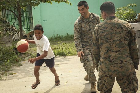 U.S. Marines with Battalion Landing Team, 2nd Battalion, 4th Marine Regiment, 31st Marine Expeditionary Unit, meet, greet and play games with Filipino children during a visit to a local school during Philippines Amphibious Landing Exercise 33 (PHIBLEX) on Col. Ernesto Ravina Air Base, Philippines, October 6, 2016. PHIBLEX is an annual U.S.-Philippine military bilateral exercise which combines amphibious capabilities and live-fire training with humanitarian civic assistance efforts to strengthen interoperability and working relationships. (U.S. Marine Corps photo by Lance Cpl. Jay A. Parks/Released)