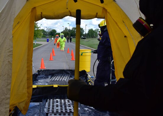 Members of the 914th Airlift Wing Fire Department prepare to enter a decontamination station as part of an exercise on Thursday, September 1, 2016. The exercise showcased interoperability of base and local first responder units in a simulated bomb attack. (U.S. Air Force photo by Staff Sgt. Richard Mekkri/released)
