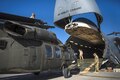 Soldiers and airmen load an UH-60 Black Hawk helicopter into a C-5 Galaxy aircraft at Bagram Airfield, Afghanistan, Sept. 8, 2016. Air Force photo by Senior Airman Justyn M. Freeman