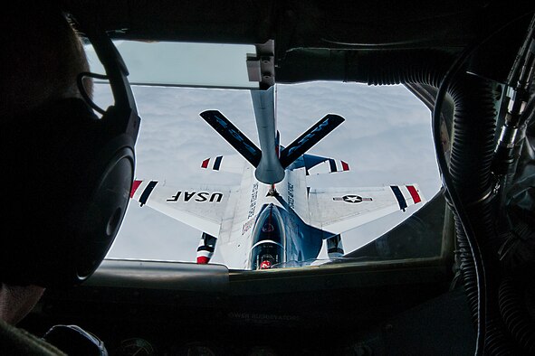 A boom operator from the 74th Air Refueling Wing refuels an F-16 Fighting Falcon from the U.S. Air Force Air Demonstration Squadron, also known as the Thunderbirds, Sept. 7, 2106 over the American Midwest. The Thunderbirds are based out of Nellis Air Force Base, Nevada and the squadron preforms approximately 75 demonstrations per year. (U.S. Air Force photo/Staff Sgt. Dakota Bergl)