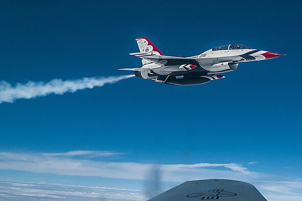 An F-16 Fighting Falcon from the U.S. Air Force Air Demonstration Squadron, also known as the Thunderbirds, flies off the wing of one of Grissom’s KC-135R Stratotanker aircraft following a successful refuel over Midwestern America on Sept. 7, 2016. The Thunderbird was traveling to the Fort Wayne Air Show when it received its refuel. (U.S. Air Force photo/Staff Sgt. Dakota Bergl)