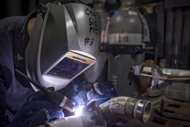 Navy Petty Officer 2nd Class Wilson Sherman welds aircraft components on the aircraft carrier USS Dwight D. Eisenhower in the Persian Gulf, Sept. 11, 2016. The Eisenhower is supporting Operation Inherent Resolve in the U.S. 5th Fleet area of operations. Navy photo by Seaman Joshua Murray