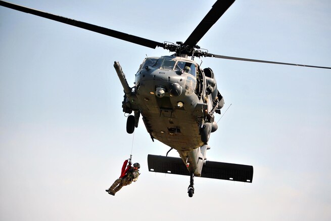 An Air Force pararescueman fast-ropes from an HH-60 Pave Hawk helicopter during a recovery demonstration at Francis S. Gabreski Air National Guard Base in Westhampton Beach, N.Y., Sept. 10, 2016. The airman is assigned to the 103rd Rescue Squadron. Air National Guard photo by Staff Sergeant Christopher S. Muncy