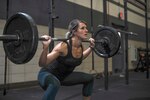 U.S. Air Force Staff Sgt. Macy Benjamin, 355th Contracting Squadron contract administrator, performs a squat exercise at the Haeffner Fitness and Sports Center at Davis-Monthan Air Force Base in Arizona, Aug. 25, 2016. Benjamin has used fitness to boost her self-esteem and finds happiness within her workouts. Air Force photo by Airman 1st Class Ashley N. Steffen