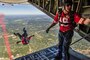A member of the Leap Frogs, the Navy&#39;s parachute demonstration team, jumps from a Hercules aircraft into Arrowhead Stadium for a football game between the Kansas City Chiefs and San Diego Chargers for service members in Kansas City, Missouri, Sept. 11, 2016. Air National Guard photo by Senior Airman Sheldon Thompson