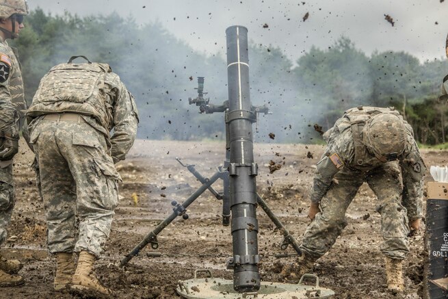 Soldiers fire an M120 mortar system as part of the Orient Shield 2016 exercise at Albano Training Area near Shiga, Japan, Sept. 13, 2016. Army photo by Spc. Patrick Kirby