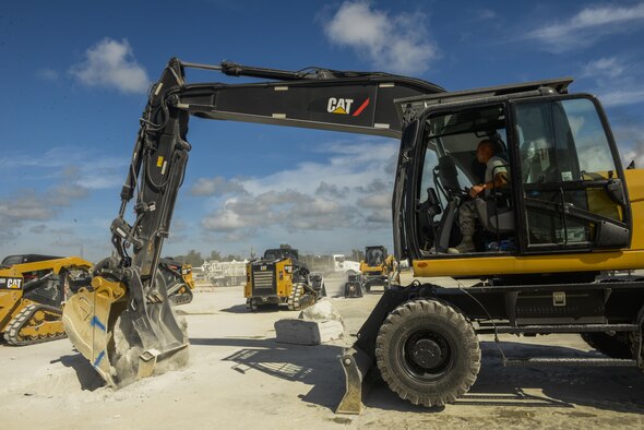 U.S. Airmen operate heavy machinery to clear debris away from a simulated damaged area created during rapid airfield damage repair training at Kadena Air Base, Japan, Sept, 15, 2016. The new process cuts the repair times from repairing three craters in 4 hours to repairing 18 in less than double that time. (U.S. Air Force photo by Senior Airman Stephen G. Eigel)