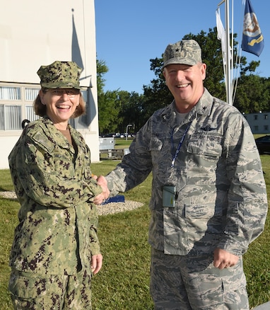 Brig. Gen. John D. Slocum, commander of the 127th Wing and Selfridge Air National Guard Base, Mich., greets Rear Adm. Linnea Sommer-Weddington, Deputy Director for U.S Strategic Command, Offutt Air Force Base here on August 5, 2017.