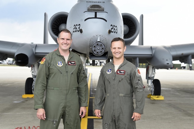 Capt. Brett DeVries (right) and his wingman Maj. Shannon Vickers, both A-10 Thunderbolt II pilots of the 107th Fighter Squadron from Selfridge Air National Guard Base, Mich.  Vickers helped DeVries safely make an emergency landing July 20 at the Alpena Combat Readiness Training Center after the A-10 DeVries was flying experienced a malfunction. (U.S. Air National Guard photo by Terry Atwell)