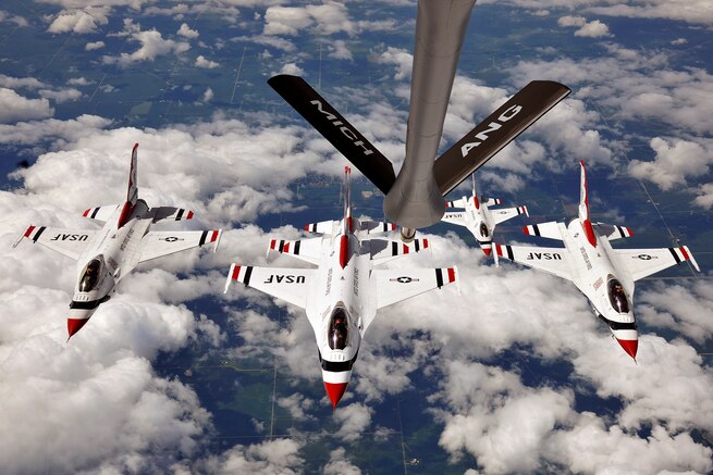 A KC-135 Stratotanker, from the 127th Wing Air Refueling Group, Selfridge Air National Guard Base Michigan, escorts five of the U.S. Air Force Thunderbirds F-16s from the 57th Wing, Nellis Air Force Base, Nevada, to perform at the Selfridge Centennial Open House and Air Show on Aug. 17, 2017.  The Thunderbirds are the U.S. Air Force’s elite demonstration flying squadron, and will perform at the Selfridge Air Show on August 19th and 20th, 2017 in celebration of the base’s 100 years of continuous flying operations.  (U.S. Air National Guard photo by MSgt. David Kujawa / Released)