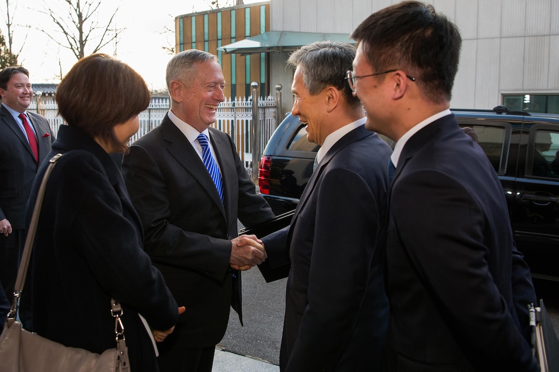 Defense Secretary Jim Mattis, center left, greets South Korea National Security Advisor, Kim Kwan-jin.