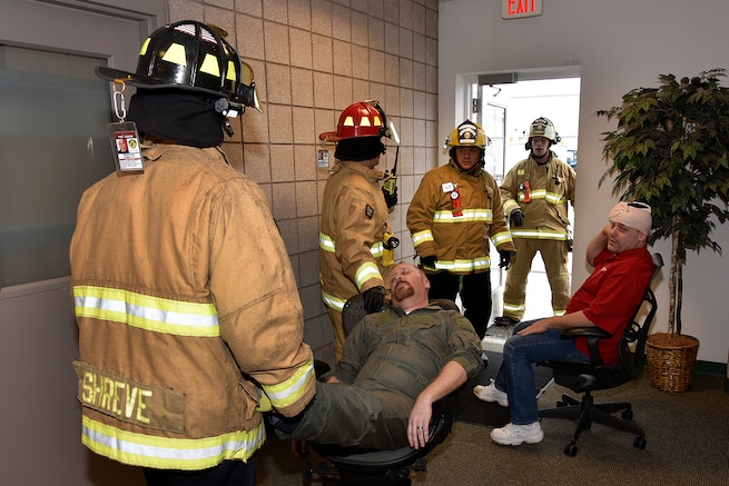 170207-Z-MI929-059 - Firefighters with the 127th Civil Engineer Squadron Fire Department evacuate casualties from a building at Selfridge Air National Guard Base, Mich., during an active shooter exercise on Feb. 7, 2017. The 127th Wing performs exercises like this one to prepare airmen and civilian employees to survive an incident on base or in their civilian lives. (Michigan Air National Guard photo by Terry L. Atwell/released)