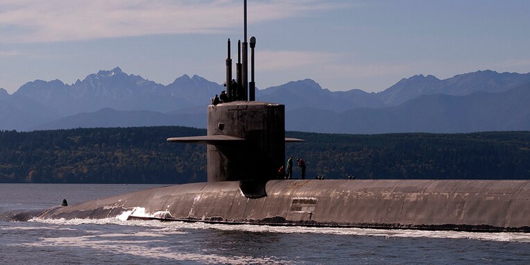 PUGET SOUND, Wash. (Oct. 15, 2017) The Ohio-class ballistic-missile submarine USS Louisiana (SSBN 743) transits the Hood Canal as it returns to its homeport following a strategic deterrent patrol. Louisiana is one of eight ballistic-missile submarines stationed at Naval Base Kitsap-Bangor providing the most survivable leg of the strategic deterrence triad for the United States. (U.S. Navy photo by Lt. Cmdr. Michael Smith/Released)