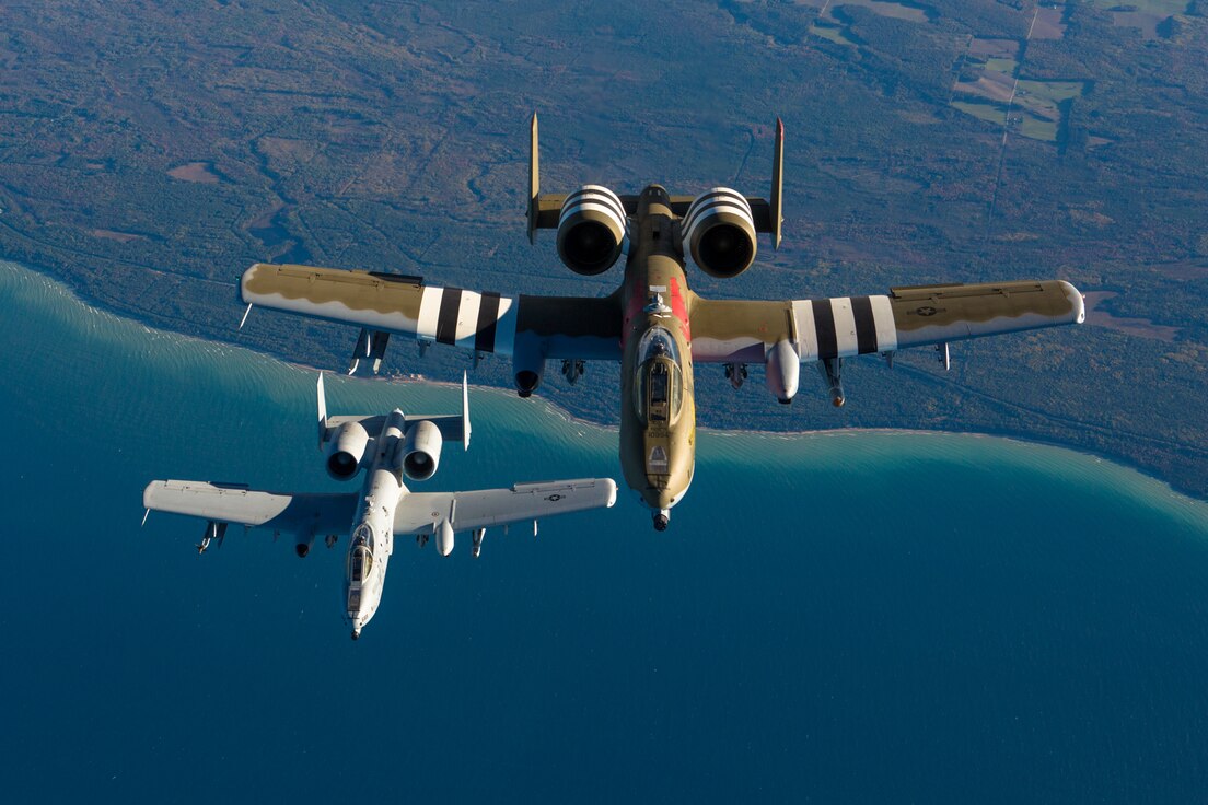 An A-10 with the 107th Fighter Squadron, flies with a KC-135 Stratotanker with the 171st Air Refueling Squadron over Northern Michigan on Oct. 11, 2017.