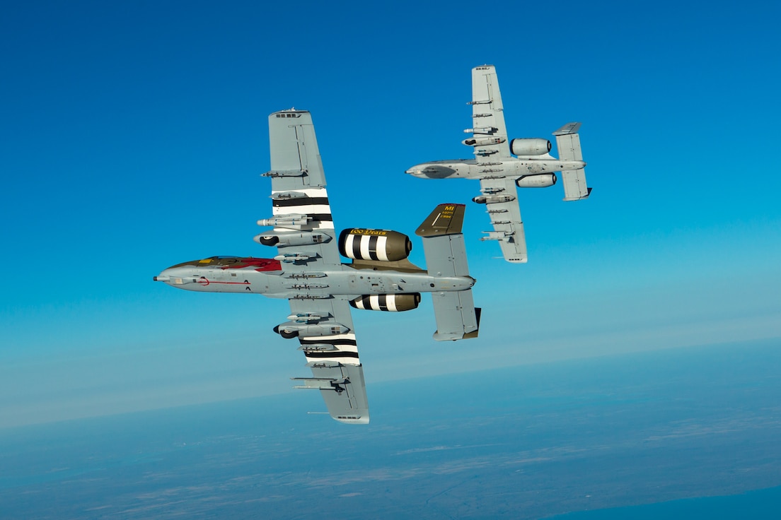 An A-10 with the 107th Fighter Squadron, flies with a KC-135 Stratotanker with the 171st Air Refueling Squadron over Northern Michigan on Oct. 11, 2017.