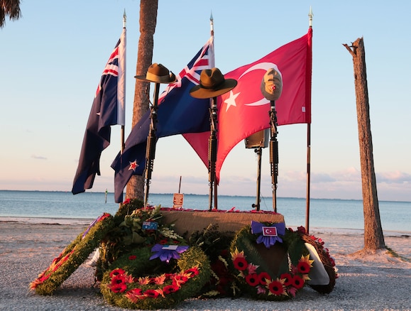 Wreaths and poppies lie below an Anzac Day memorial following a dawn service on the beach at MacDill Air Force Base, April 25. Personnel from U.S. Central Command, U.S. Special Operations Command, and other base commands attended the commemoration service that marks the anniversary of the military campaign on the Gallipoli Peninsula fought by Australian and New Zealand forces during World War I.  ANZAC Day also commemorates the lives lost by Australians and New Zealanders during World War II and subsequent military and peacekeeping operations. (Photo by Tom Gagnier)