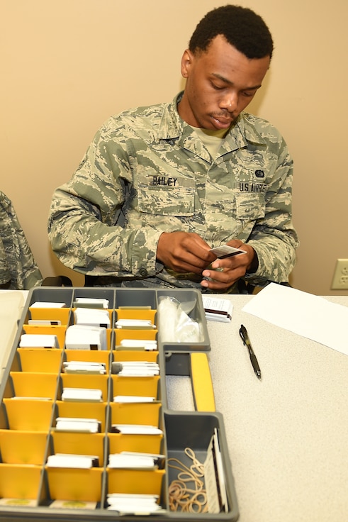 Airman 1st Class Jaylin Bailey, lodging journeyman, 127th Force Support Squadron, Selfridge Air National Guard Base, Mich., assists in out processing members of the 127th Wing on August 2, 2018 at the Alpena Combat Readiness Training Center here.