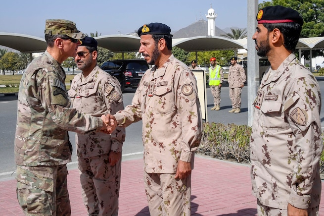 U.S. Army Gen. Joseph L. Votel, commander, U.S. Central Command, shakes hands with officers of the armed forces of the United Arab Emirates (UAE) during exercise Native Fury 18, Jan. 24, 2018. The exercise is designed to train Marines and Sailors in Maritime Prepositioning Force operations and aimed to increase proficiency, expand levels of cooperation, enhance maritime capabilities and promote long-term regional stability and interoperability between the United Arab Emirates and the United States. (U.S. Air Force photo by Tech Sgt. Dana Flamer)