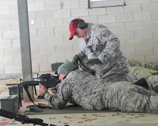 Staff Sgt. Jeff DeClercq works with a fellow Airman at the rifle marksmanship range at Selfridge Air National Guard Base, Mich., Feb. 4, 2018. The Citizen-Airmen of the 127th Wing spent the February regularly scheduled drill focused on expeditionary skills training.