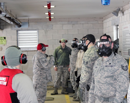 Michigan Air National Guard Airmen prepare to engage in rifle marksmanship training while wearing gas masks at Selfridge Air National Guard Base, Mich., Feb. 4, 2018. The Citizen-Airmen of the 127th Wing spent the February regularly scheduled drill focused on expeditionary skills training.