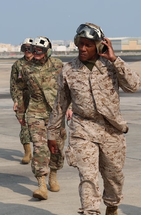 U.S. Marine Corps Maj. Gen. Michael E. Langley, right, and U.S. Army Gen Joseph L. Votel, commander, U.S. Central Command, left, depart to visit U.S. Marines and sailors with the USS Essex Amphibious Ready Group (ARG) and the embarked 13th Marine Expeditionary Unit (MEU), Oct. 26, 2018. The USS Essex ARG and 13th MEU are deployed to the U.S. 5th Fleet area of operation in support of naval operations to ensure maritime stability and security in the Central Region. (Department of Defense photo by U.S. Army Sgt. Franklin Moore)