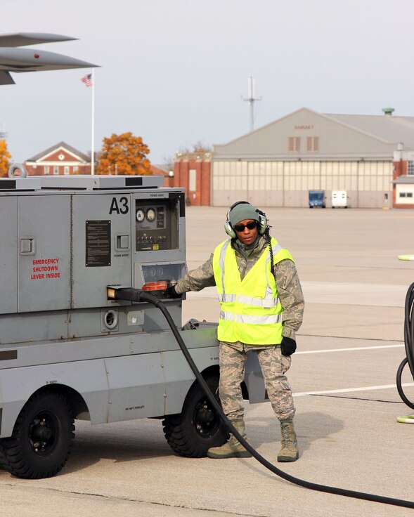 Senior Airman Leslie Whitfield, a KC-135 Stratotanker crew chief, operates an auxiliary power unit during pre-flight operations at Selfridge Air National Guard Base, Mich., Nov. 4, 2018.