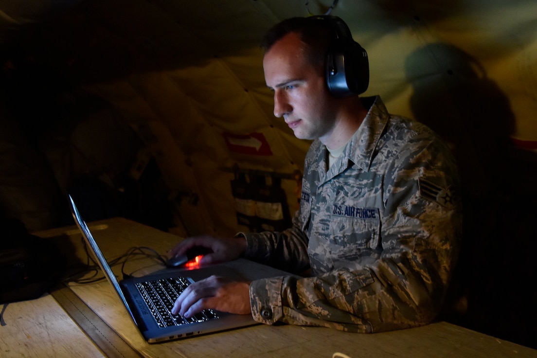 Senior Airman Ryan Zeski utilizes time during a long flight as a passenger on a Michigan Air National Guard KC-135 Stratotanker to work on some homework for a course he is taking at Oakland University in MIchigan, Nov. 8, 2018.