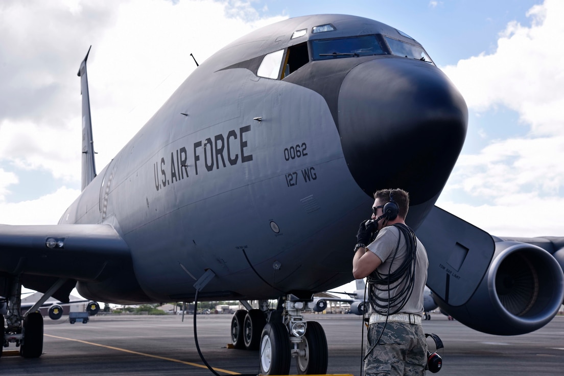 Airman 1st Class Nathaniel Sanchez, a crew chief with the Hawaii Air National Guard's 154th Air Refueling Wing, prepares to service a KC-135 Stratotanker from the Michigan Air National Guard's 127th Wing at Joint Base Pearl Harbor Hickam, Hawaii, Nov. 5, 2018.