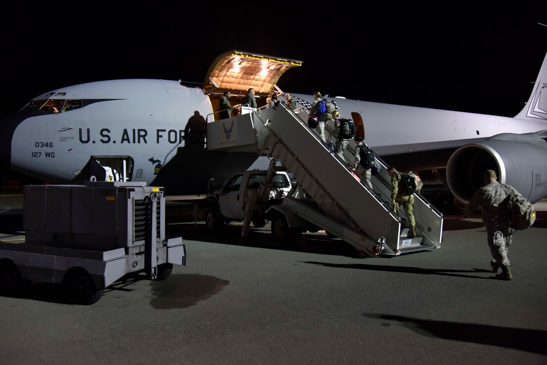 A group of Michigan Citizen-Airmen board a KC-135 Stratotanker prior to an early evening take-off at Joint Base Pearl Harbor Hickam, Hawaii, Nov, 9, 2018.