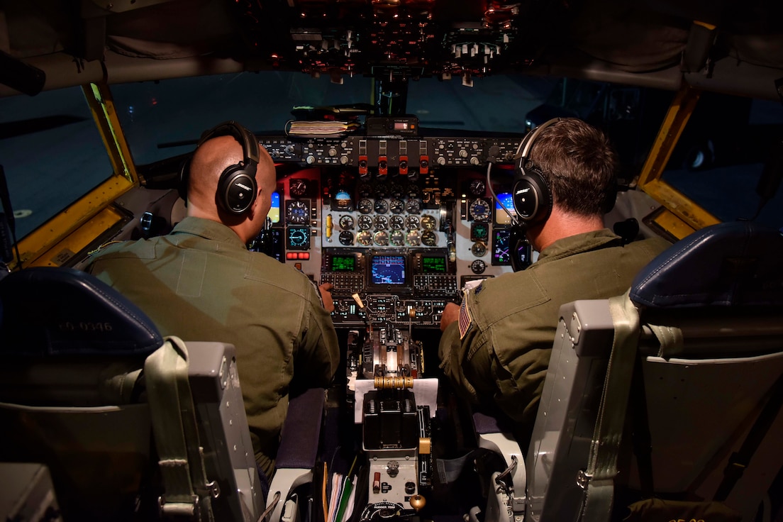 Two 171st Air Refueling Squadron pilots run through their pre-flight check-list aboard a KC-135 Stratotanker prior to an early evening take-off at Joint Base Pearl Harbor Hickam, Hawaii, Nov, 9, 2018.