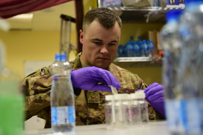 Senior Airman Adam Sanders, 386th Air Expeditionary Medical Group environmental program manager, conducts a water-sample test Oct. 3, 2018, at an undisclosed location in Southwest Asia. Sanders and the rest of the bioenvironmental team ensure Airmen are safe wherever they work by evaluating workplace hazards including extreme noise and radiation exposure. (U.S. Air Force photo by Staff Sgt. Christopher Stoltz)