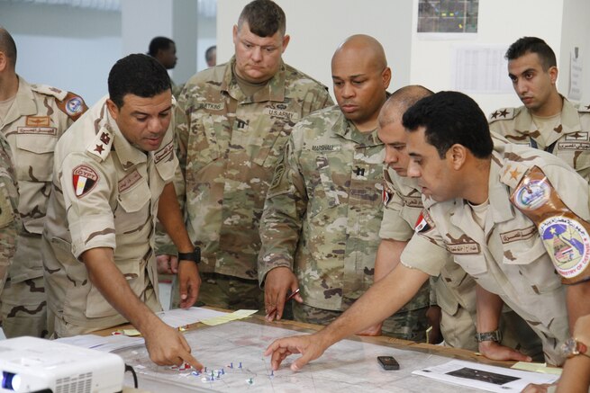 Soldiers from both the United States and Egyptian armed forces review battle plans during the command post exercise September 10, 2018. The command post exercise was designed to strengthen strategic relationships between multinational armed forces to solve potential real life threats. (U.S. Army photo by 1st Lt. Jeffrey Dallin Belnap)