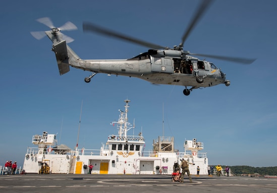 HSC-23 Sailors load a training dummy into a rescue litter aboard USNS Mercy as part of Pacific Partnership 2018 humanitarian assistance exercise..