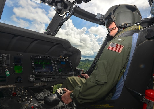 Rear Adm. Joey Tynch pilots a Royal Brunei Air Force S-70i Black Hawk.