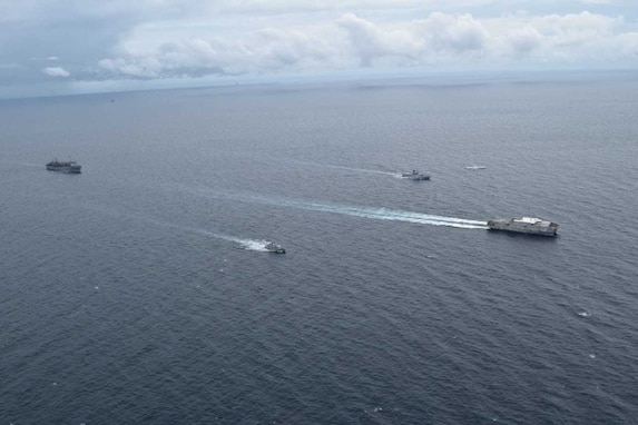 USNS Fall River steams in formation with Royal Brunei Navy ships.