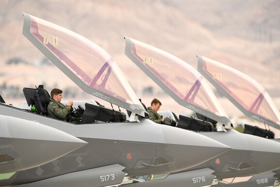 Pilots from the 388th Fighter Wing's 4th Fighter Sqaudron prepare for launch,
