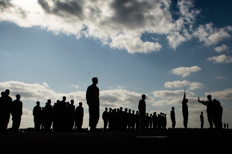Marines stand in formation during a ceremony.