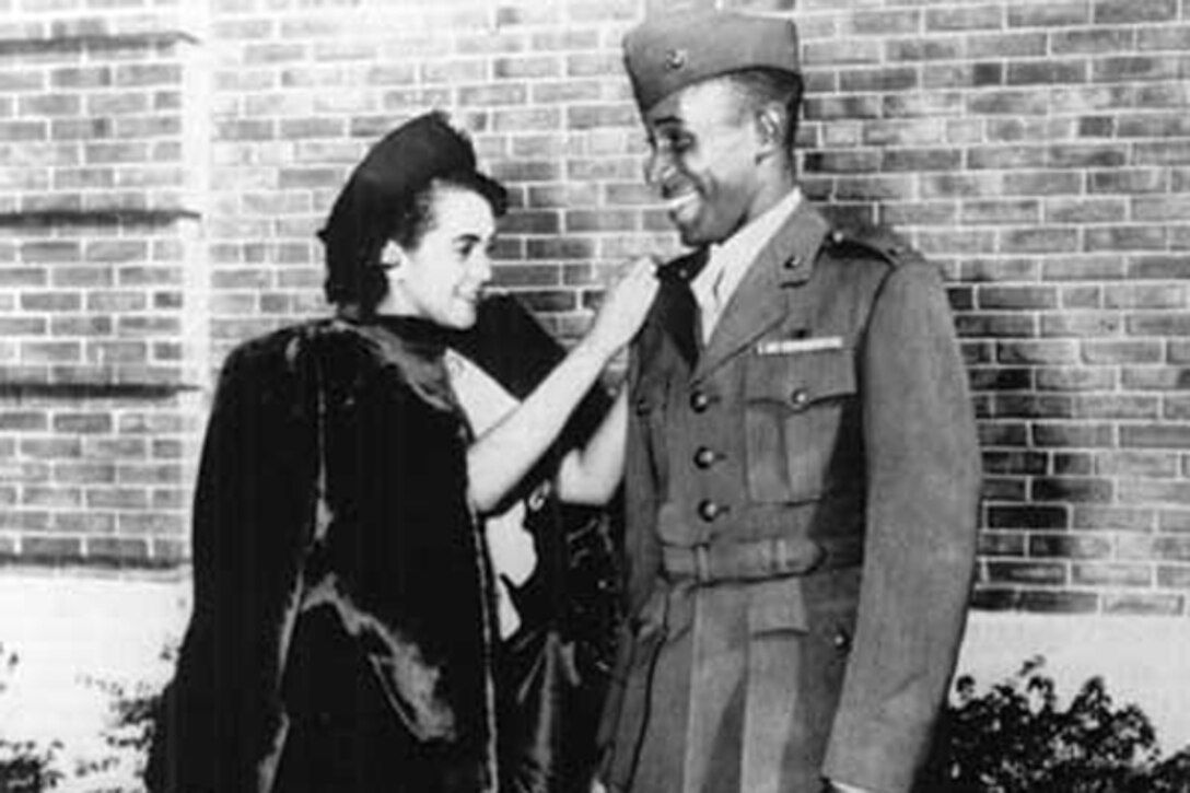 Frederick C. Branch, the first African-American officer in the Marine Corps, is pinned on a second lieutenant by his wife Nov. 10, 1945. In honor of his achievement, the Marine Corps offers Frederick C. Branch Leadership Scholarships to students at 17 historically black colleges and universities across the country.