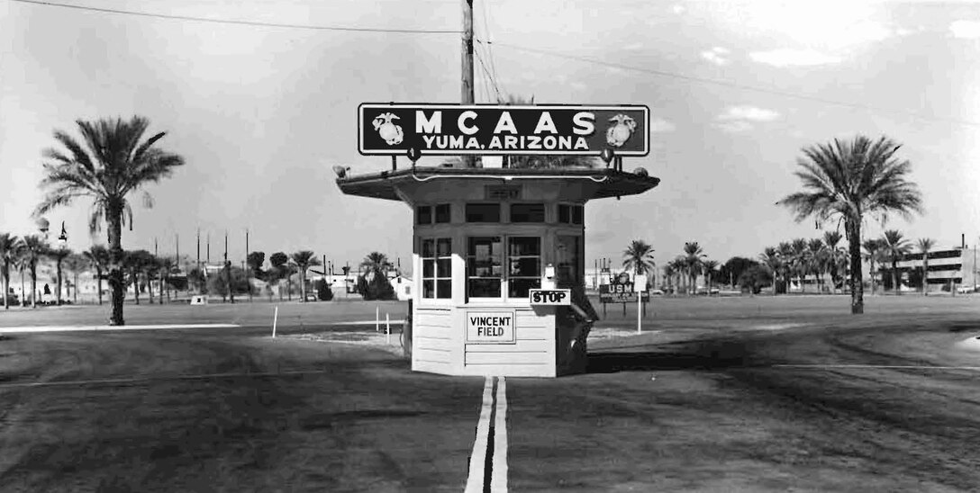 Approximately 10 months after the Marine Corps took over what was Vincent Air Force Base, a sign for Vincent Field remains on the main gate of the Marine Auxiliary Air Station Yuma on Sept. 26, 1959. The station dropped the word "auxiliary" on July 20, 1962. One of the first four Marines assigned to the air station in 1958 as part of the transition team, Reg Garavito, returned to Yuma Jan. 12, 2010, and donated the photo to the station.